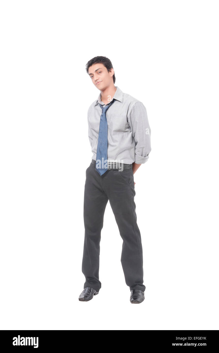 Businessman with a suspicious look , standing with hands at the back Stock Photo