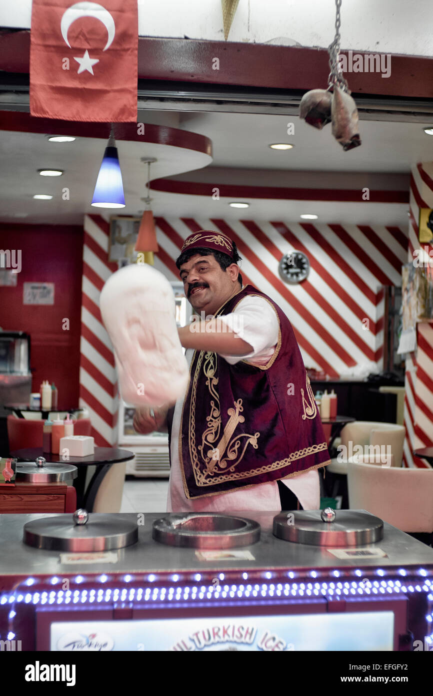 Turkish ice cream (Dondurma) vendor twirling and rotating the product Stock Photo