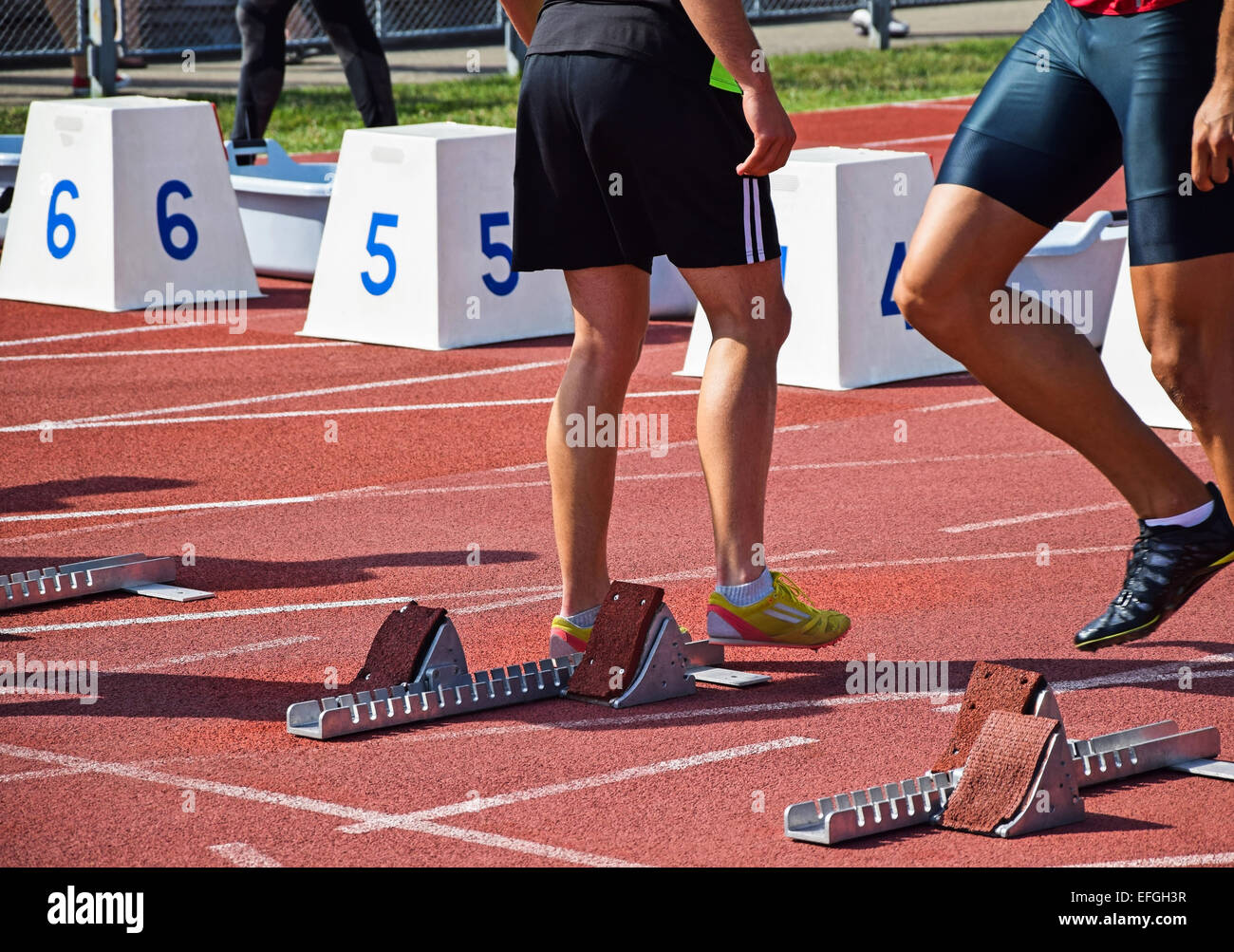 Runners at the starting line of the running track Stock Photo Alamy