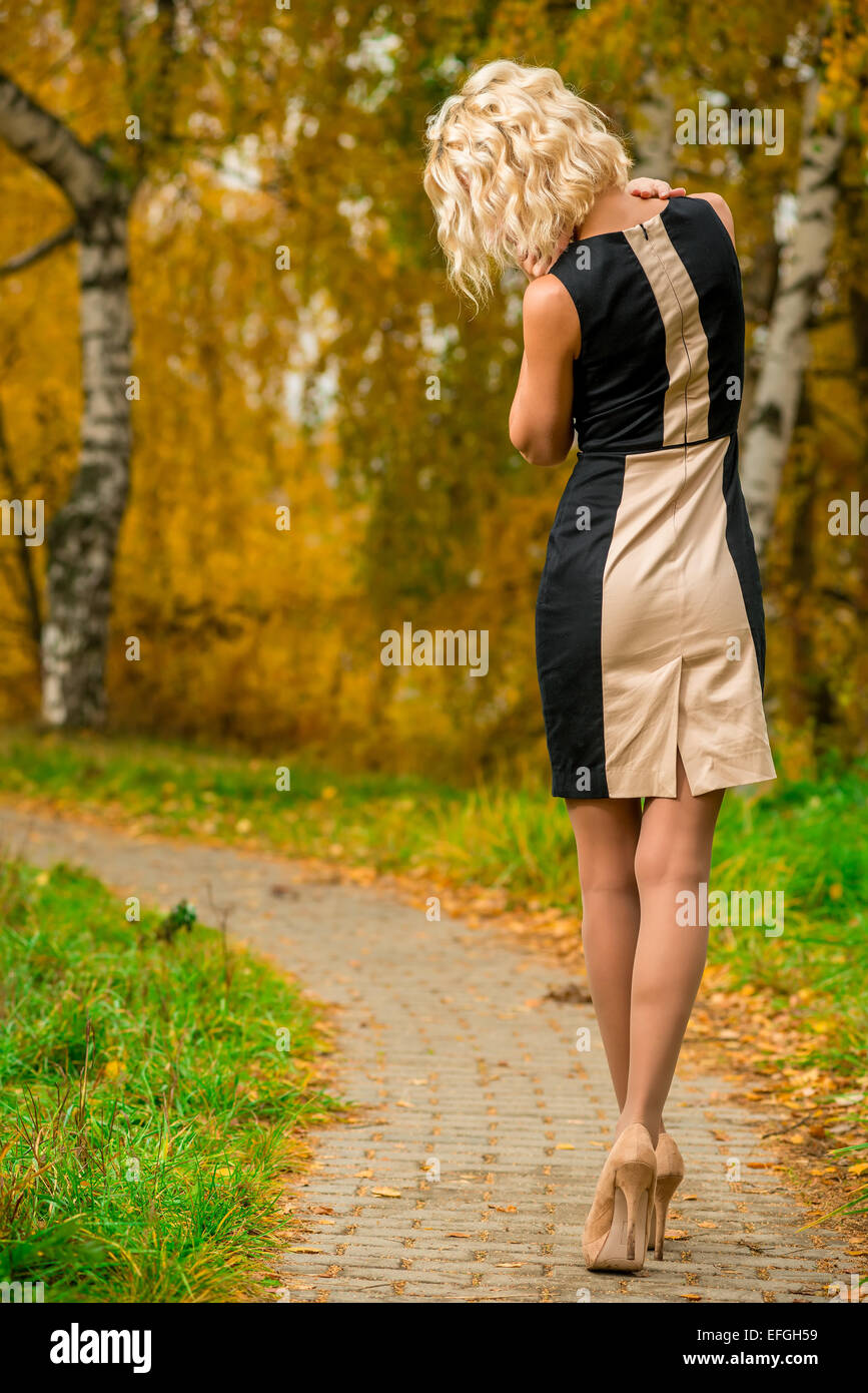 Beautiful blonde woman walks hi-res stock photography and images - Alamy