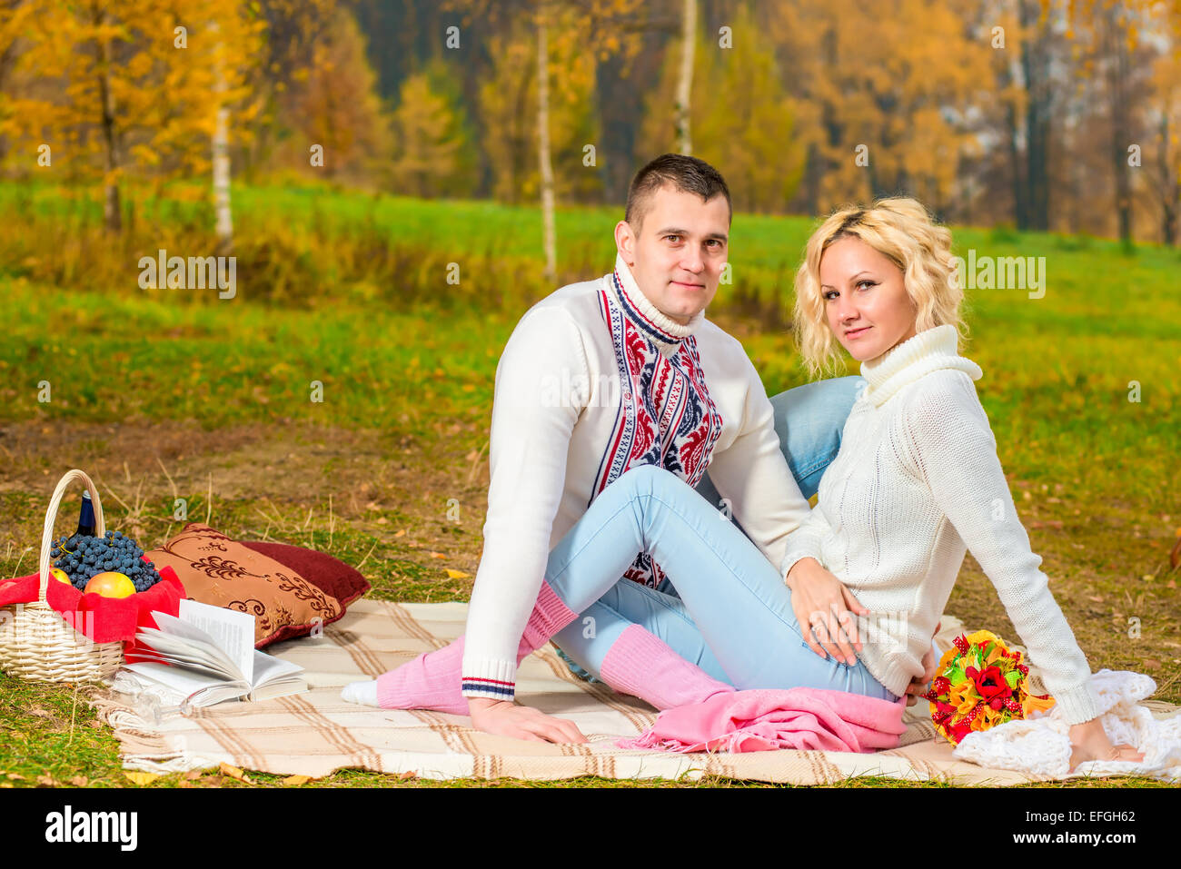family picnic young couple in autumn park on the nature Stock Photo