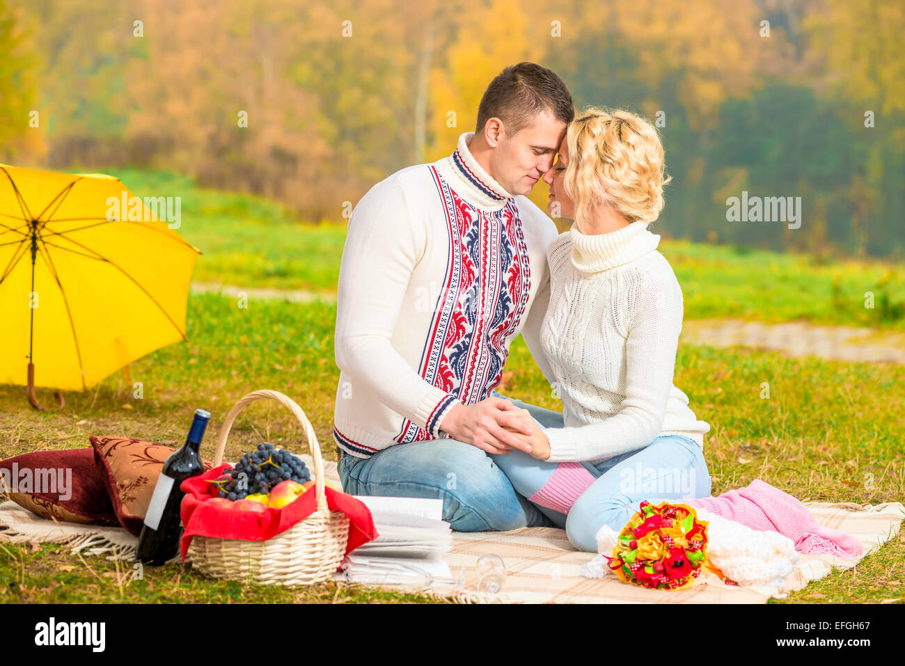 affectionate relationship of young couples in nature Stock Photo