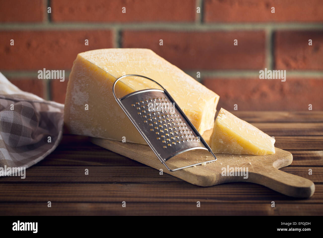 https://c8.alamy.com/comp/EFGJDH/the-cheese-grater-and-parmesan-EFGJDH.jpg
