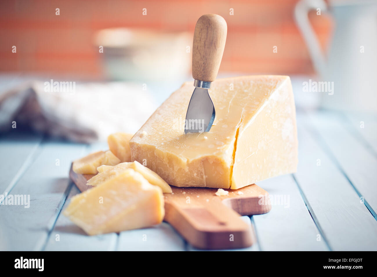 the parmesan cheese on cutting board Stock Photo