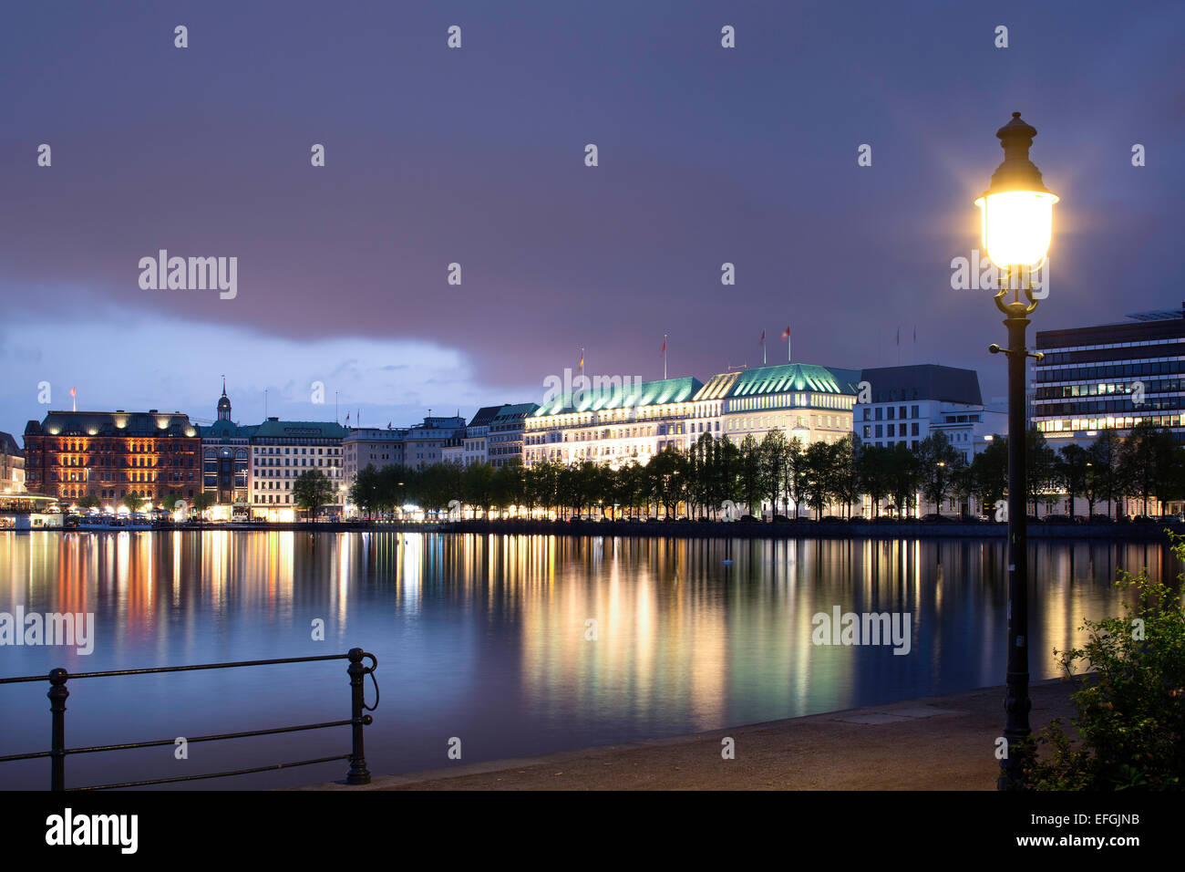 View across the Inner Alster towards representative office buildings, hotels, and commercial buildings on Jungfernstieg Stock Photo