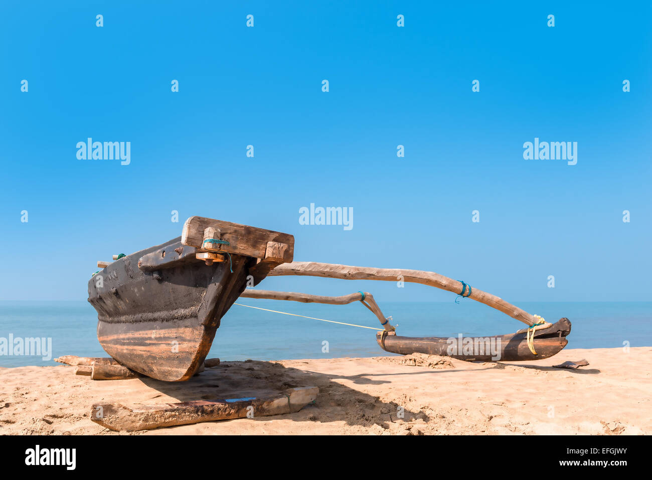 old wooden fishing boat on the beach of a tropical beach Stock Photo ...