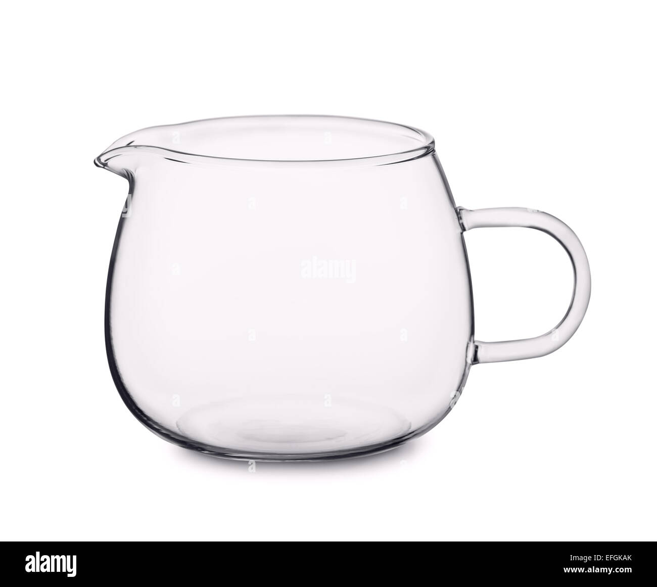 Empty glass cream jug isolated on white Stock Photo