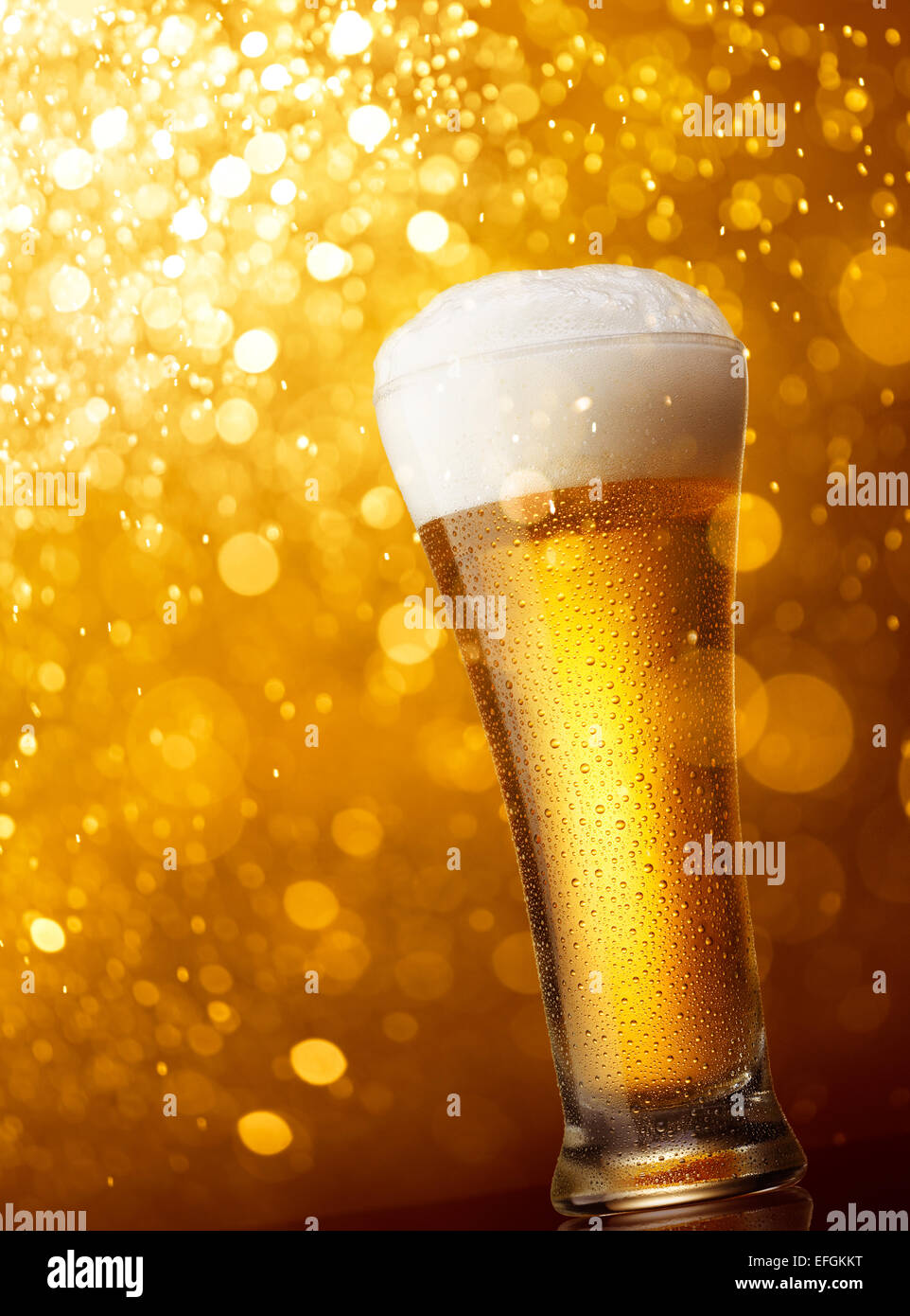Download Glass Of Beer Against Gold Bokeh Lights Background Stock Photo Alamy PSD Mockup Templates