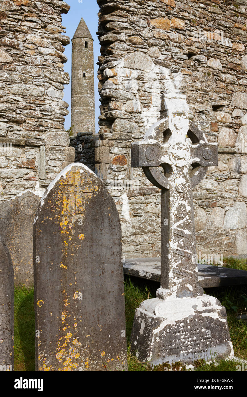 Tomb stones, St Kevin's Cathedral and Round Tower, Glendalough, County Wicklow, Ireland Stock Photo