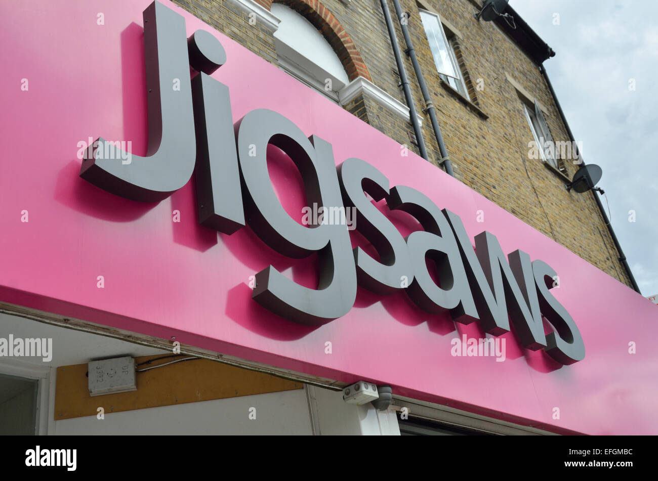 Jigsaws estate agents sign logo outside their offices Stock Photo Alamy