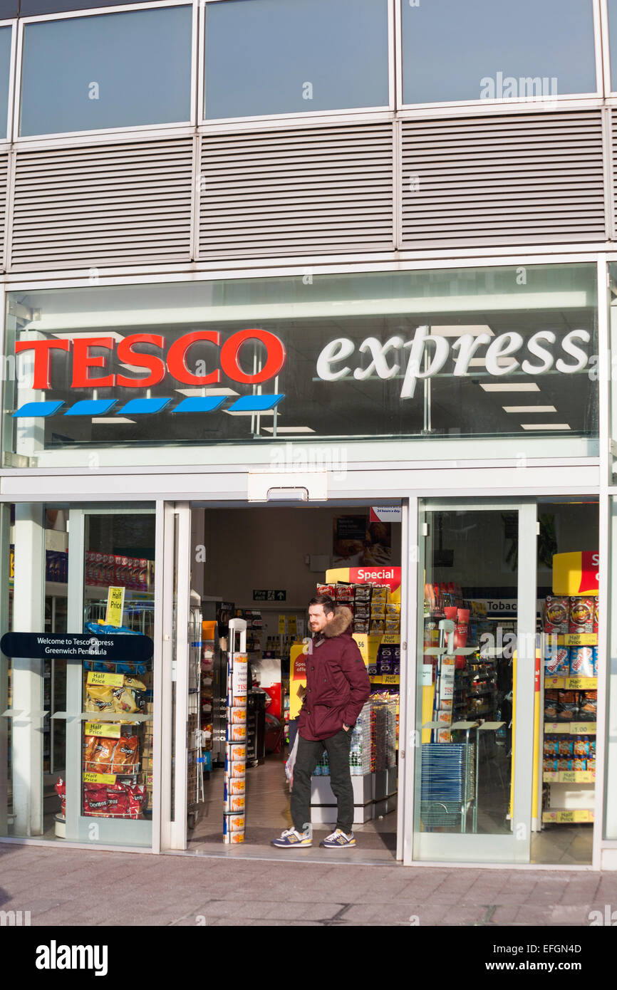 Tesco Express store, shop front exterior entrance, at Greenwich Peninsula, London, UK in February Stock Photo