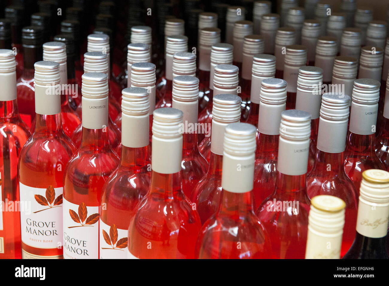 Bottles of rose wine on a shelf in a UK budget supermarket Stock Photo