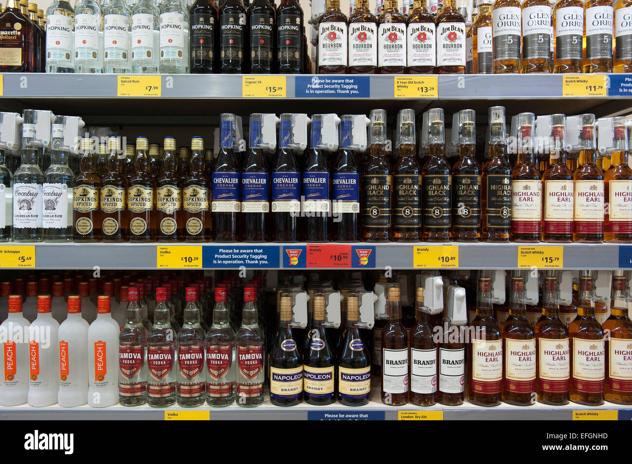 Bottles of cheap alcohol including brandy, whisky and vodka on shelves in a UK budget supermarket. Stock Photo