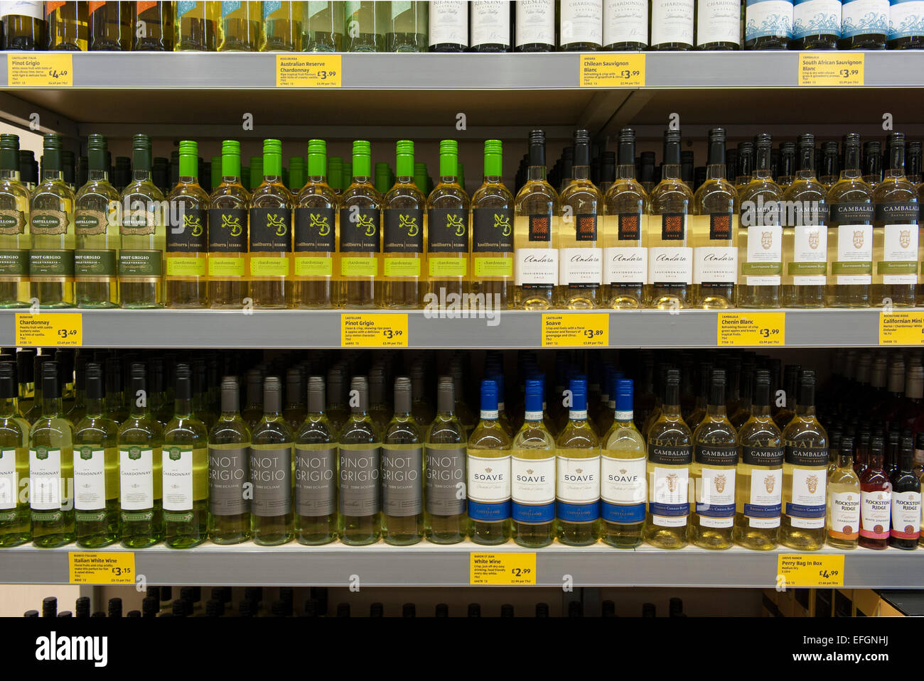 Bottles of cheap white wine on shelves in a UK budget supermarket. Stock Photo