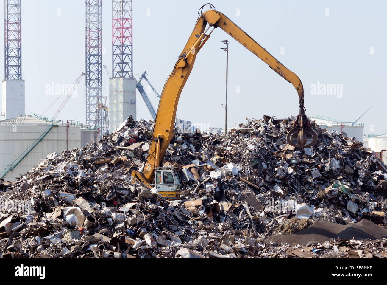 Scrap metal dump with crane. Stock Photo