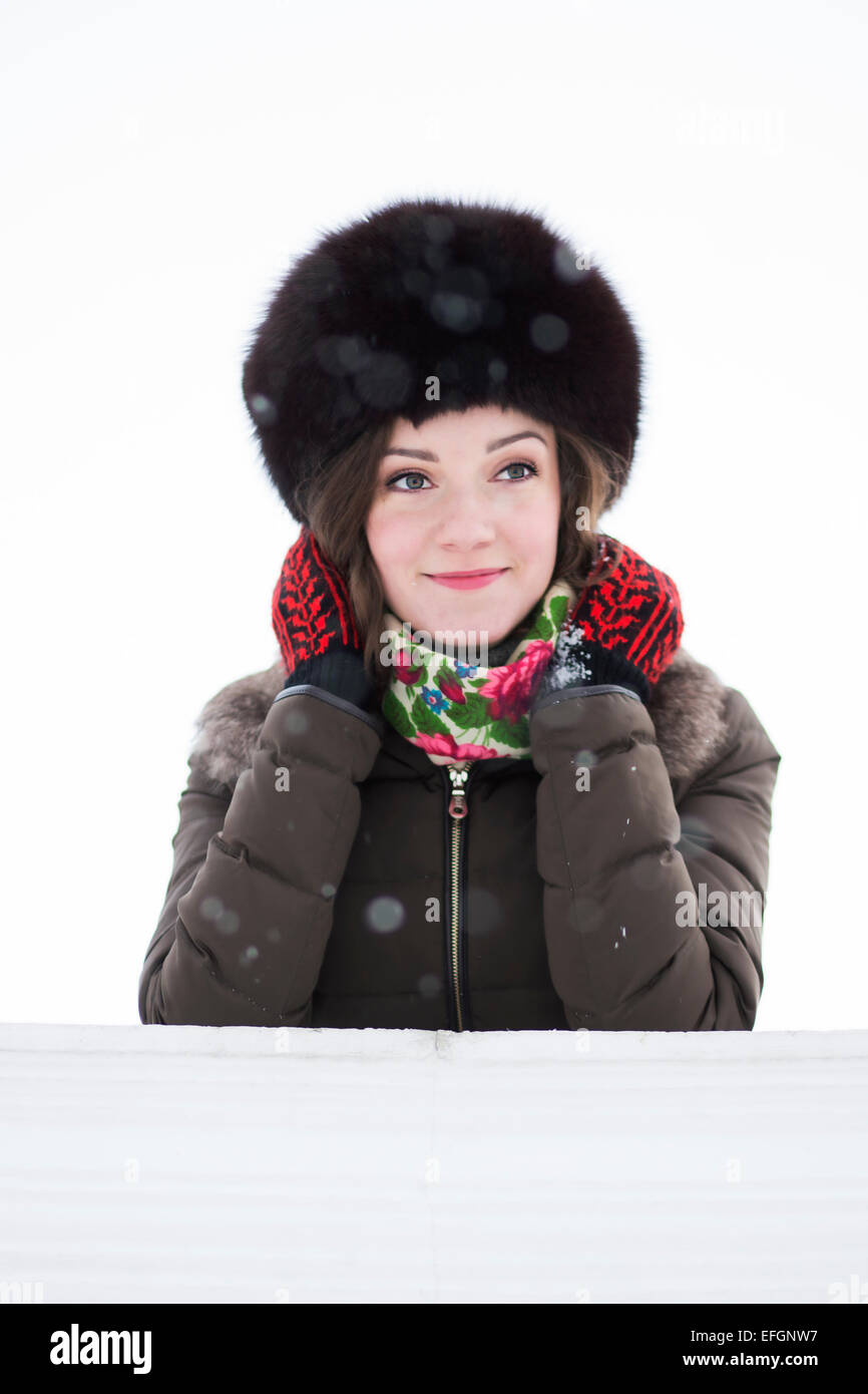 Portrait of a cute smiling woman in the light snowfall Stock Photo - Alamy