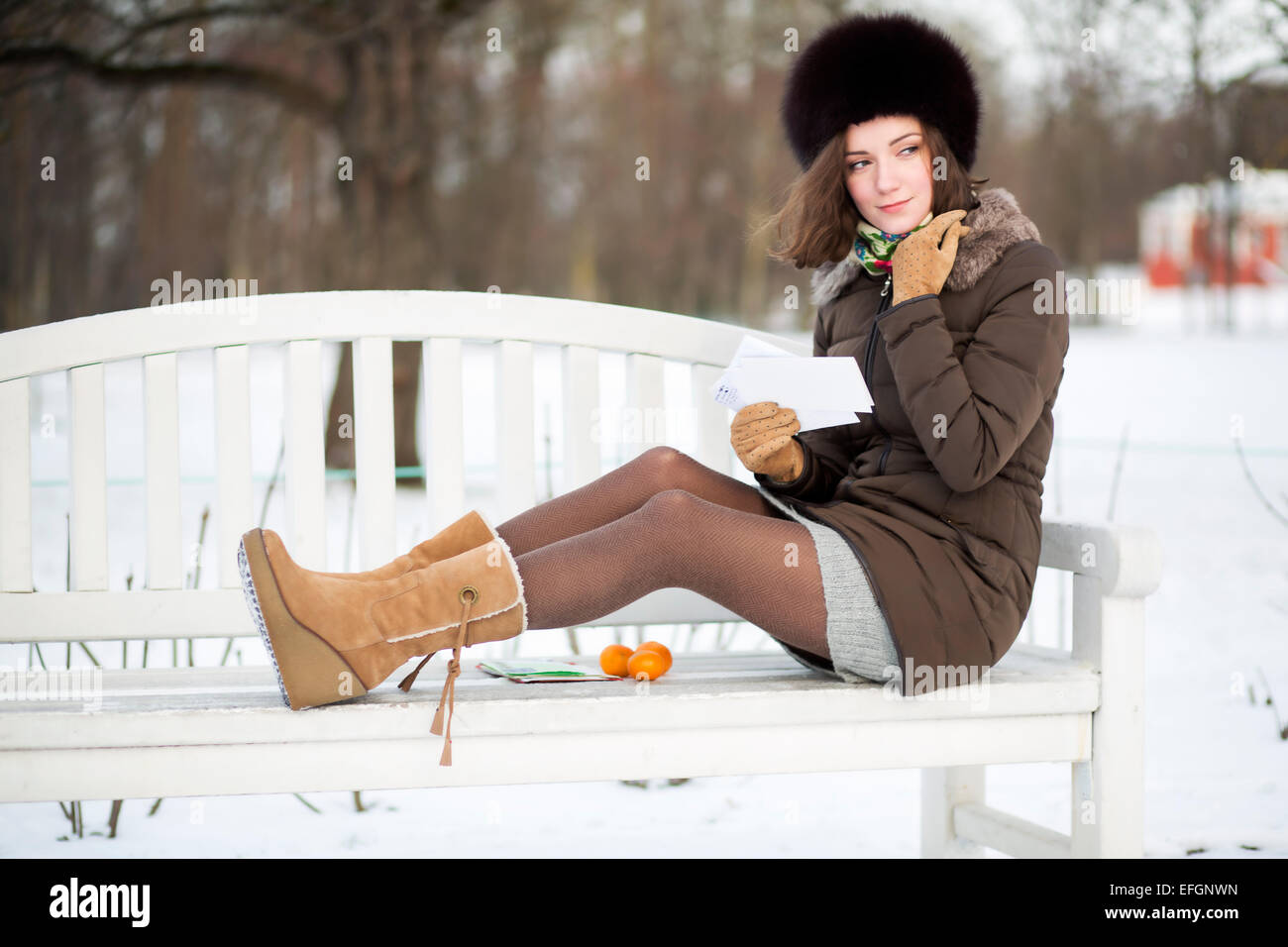 Nice girl sitting on bench hi-res stock photography and images - Alamy