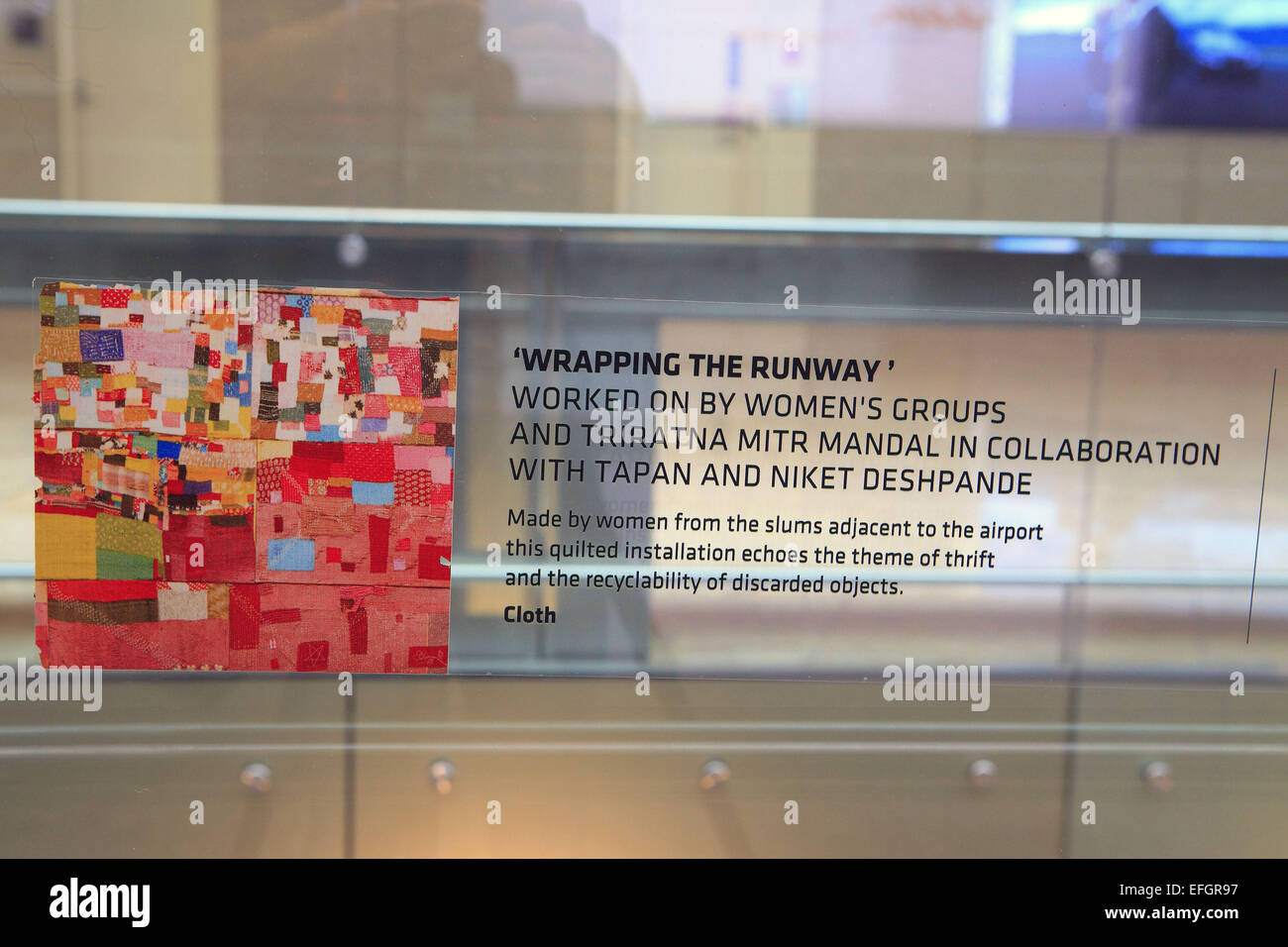 Mumbai, Maharashtra, India. 24th Dec, 2014. 24 december 2014 - Mumbai - INDIA :.A Art installation '' WRAPPING THE RUNWAY '' at Mumbai's new International Airport terminal T2.Made with Cloth by women from the slums adjacent to the Mumbai airport.this quilted installation echoes the theme of thrift and the recyclebility of discarded objects. © Subhash Sharma/ZUMA Wire/ZUMAPRESS.com/Alamy Live News Stock Photo
