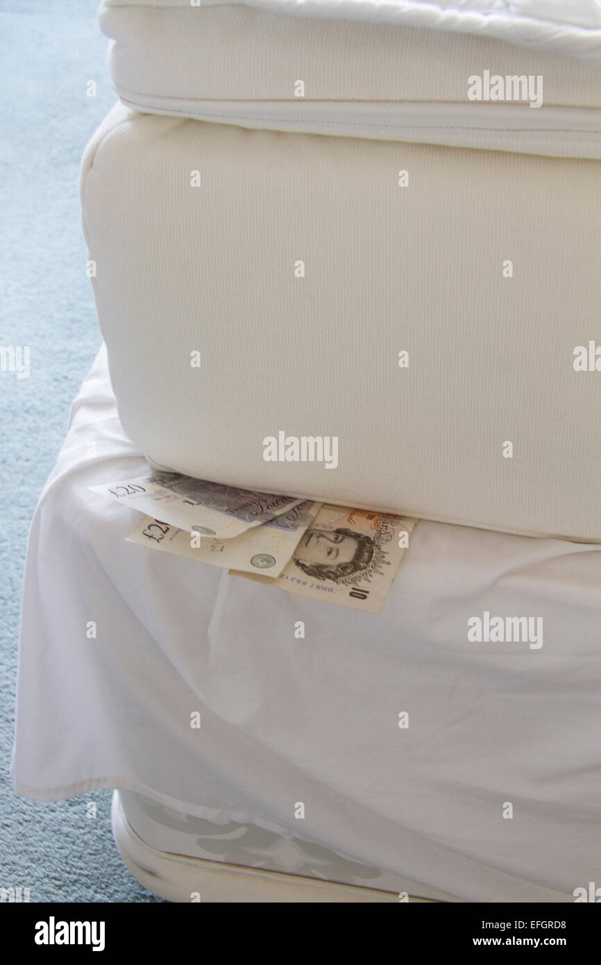 Cash under a mattress Stock Photo Alamy