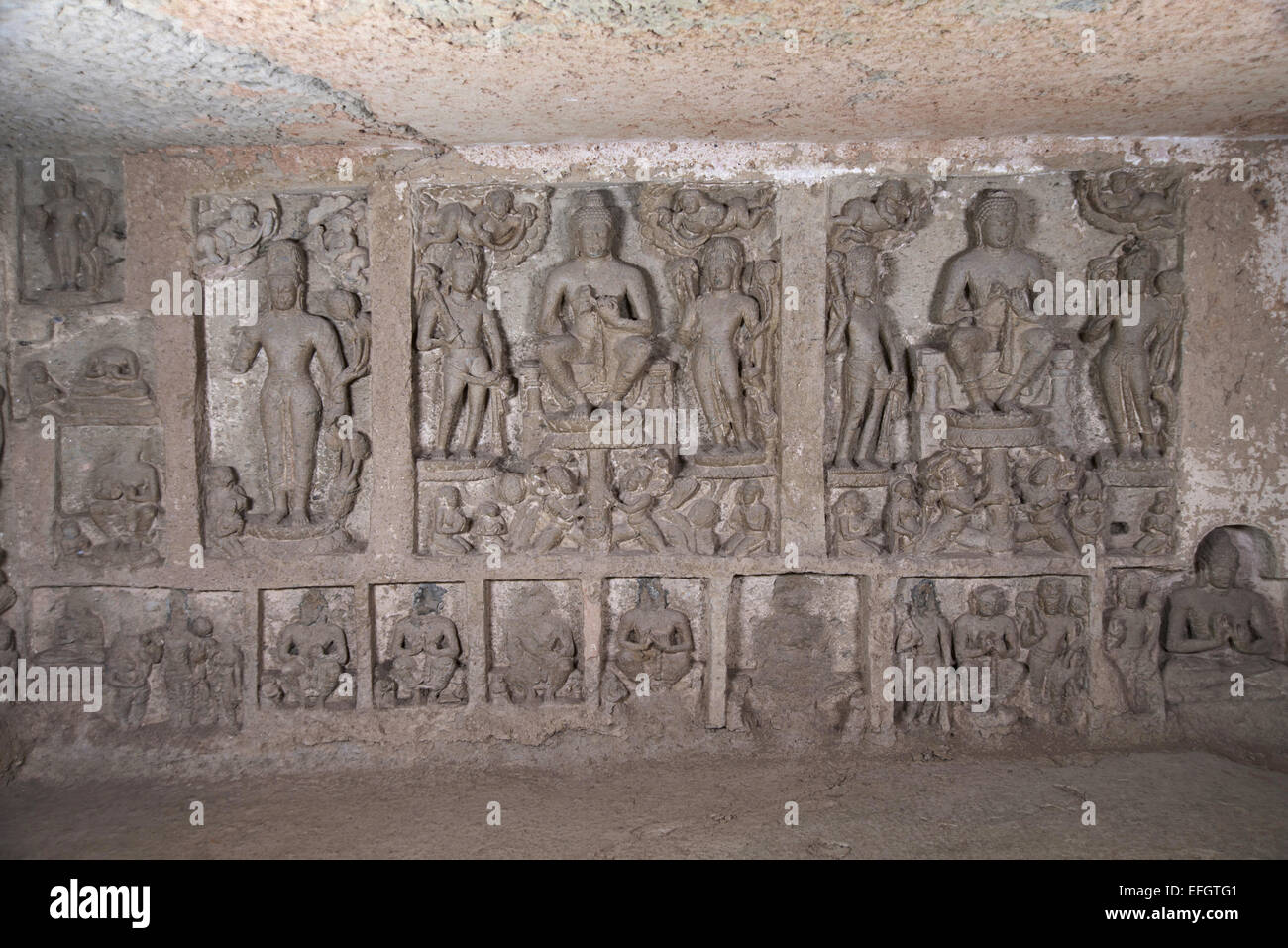 Cave 90 Buddha's on the left wall of the main hall. Kanheri Caves Borivali, Mumbai, India. Stock Photo