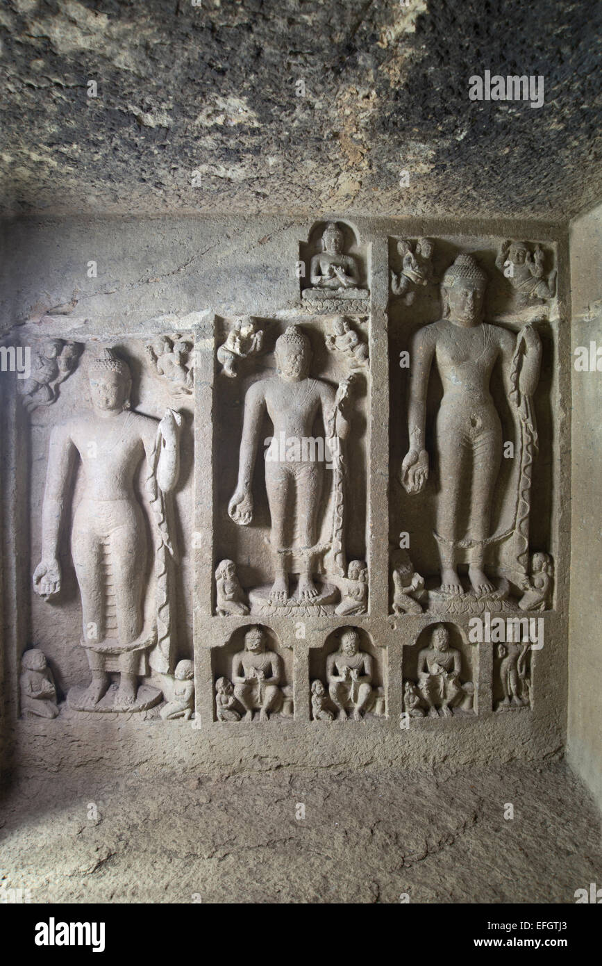 Cave 90 Buddha images on the left wall. Kanheri Caves Borivali, Mumbai, India. Stock Photo