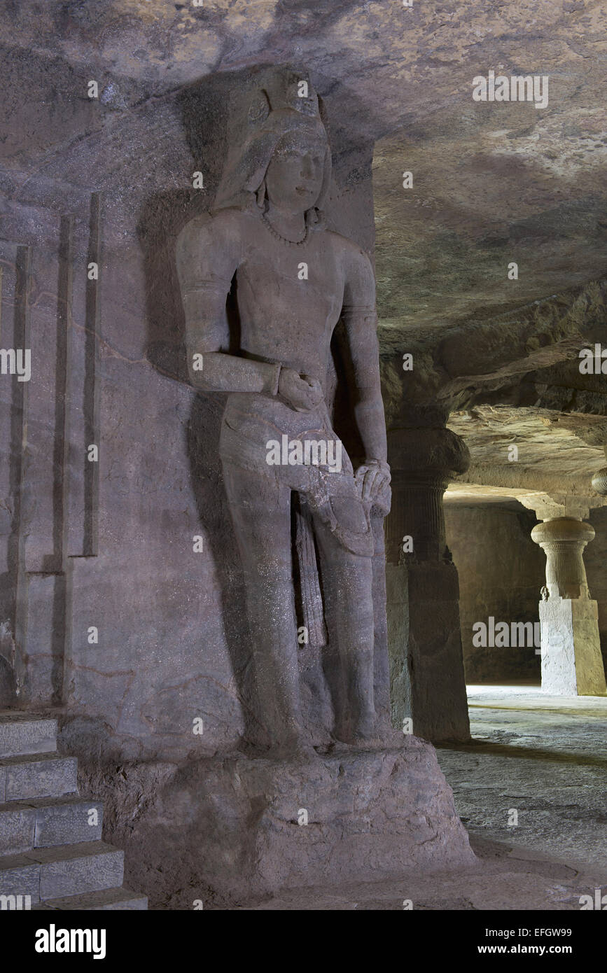 Guardian figure on the right of the Linga shrine. View from South. Elephanta Caves, Mumbai India Stock Photo