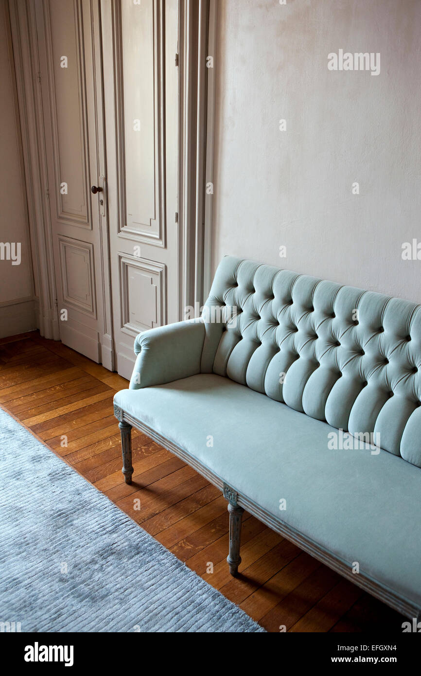 Velvet sofa in a living room Stock Photo Alamy