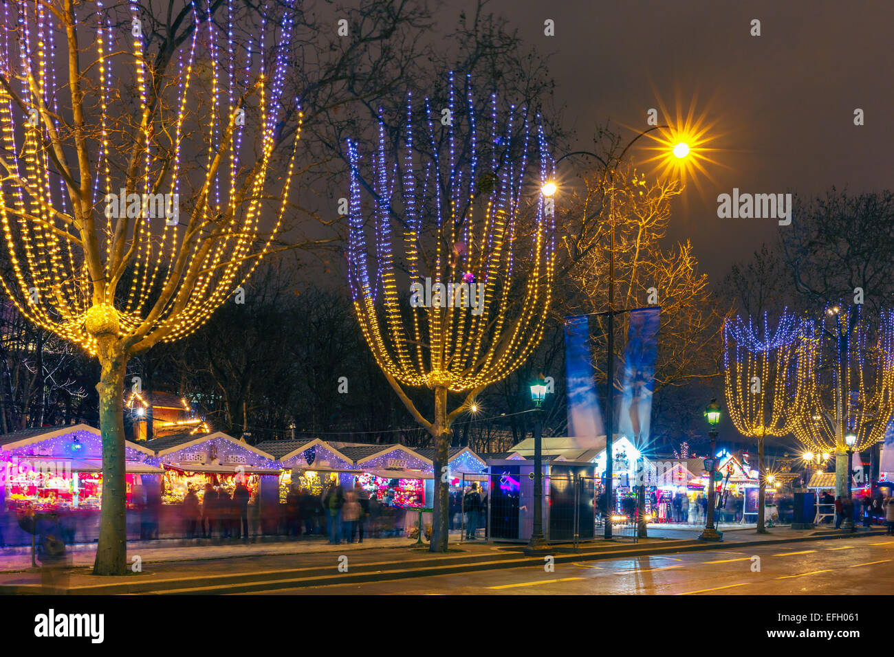 Christmas market on the Champs Elysees in Paris at night Stock Photo