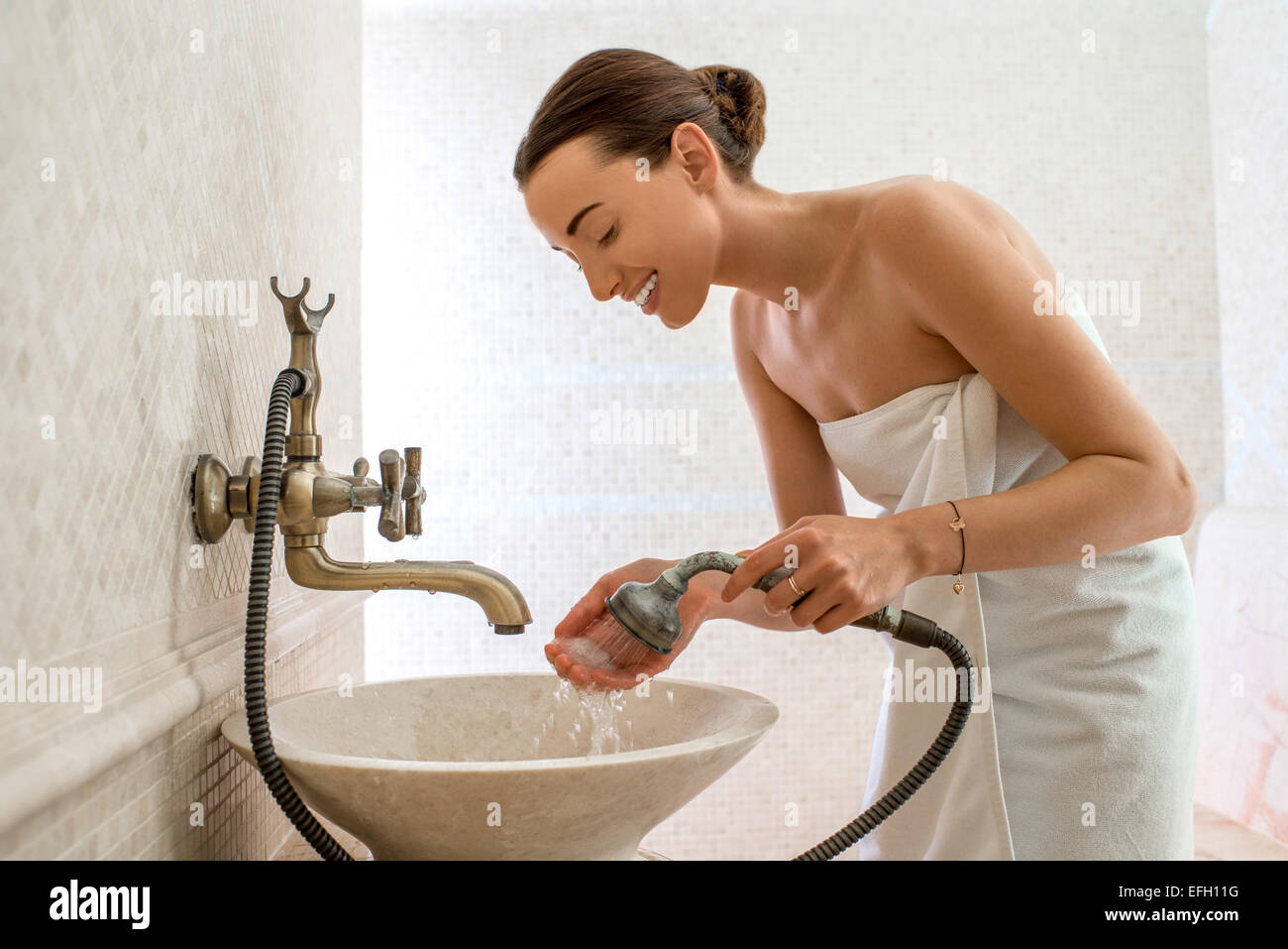 Woman in the bathroom Stock Photo - Alamy