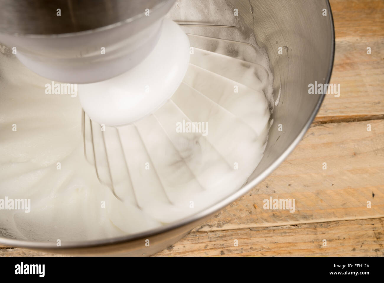 Egg whites being whisked inside a modern food processor Stock Photo Alamy