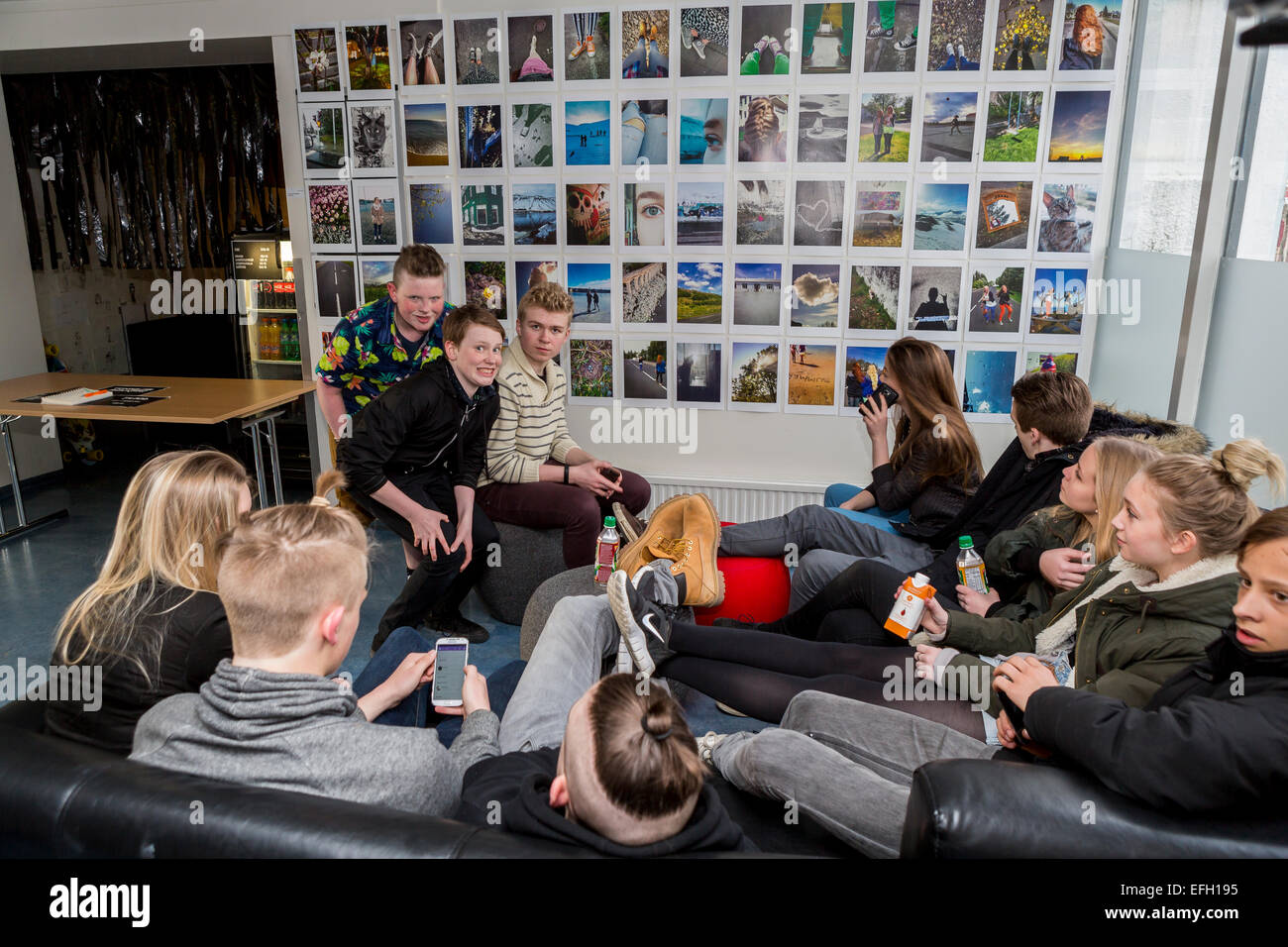 Group of teenagers sitting together at an art exhibition. Annual Children's Festival, Reykjavik, Iceland Stock Photo