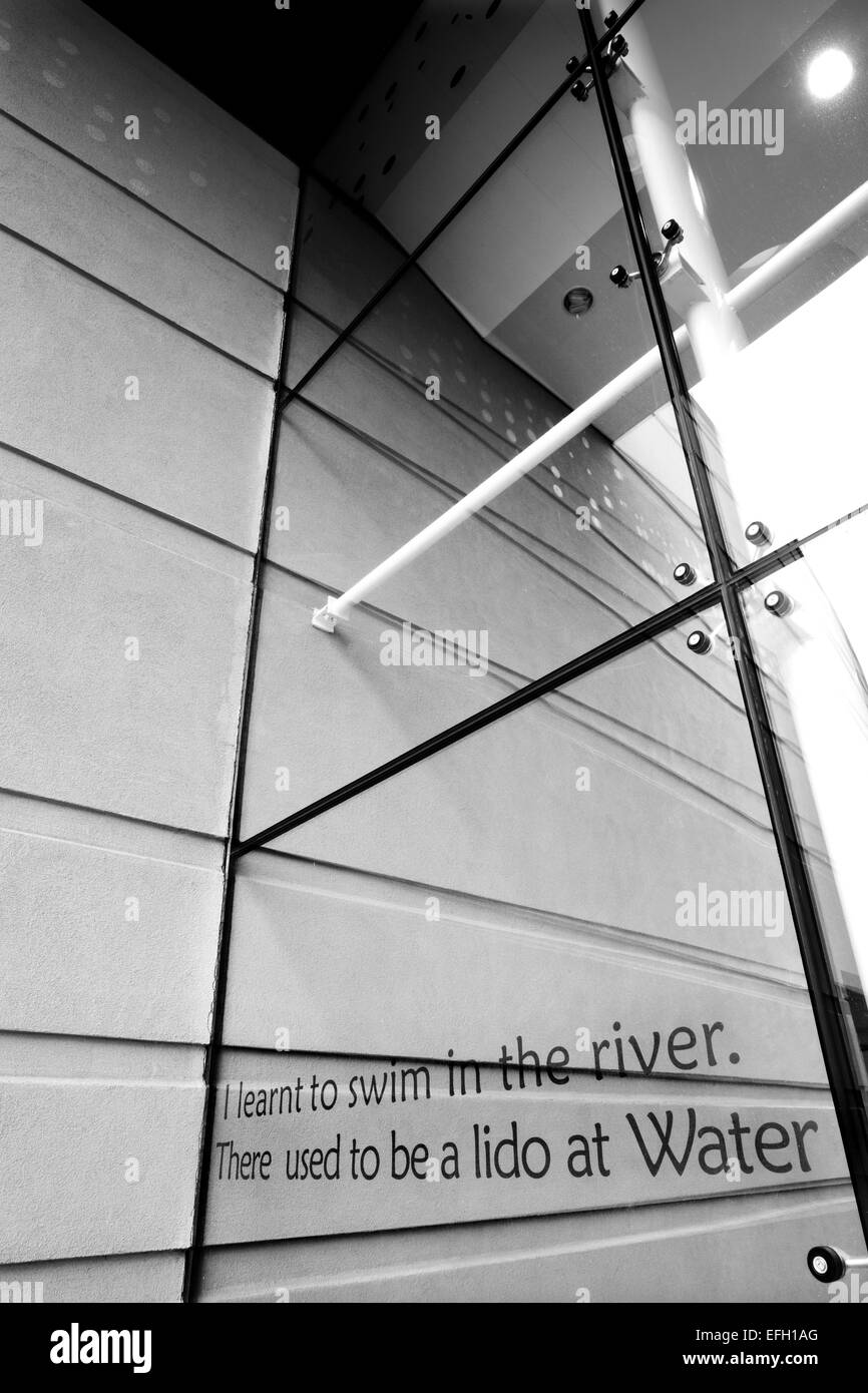 Words on glass walled entrance of car dealership showroom, black and white Stock Photo