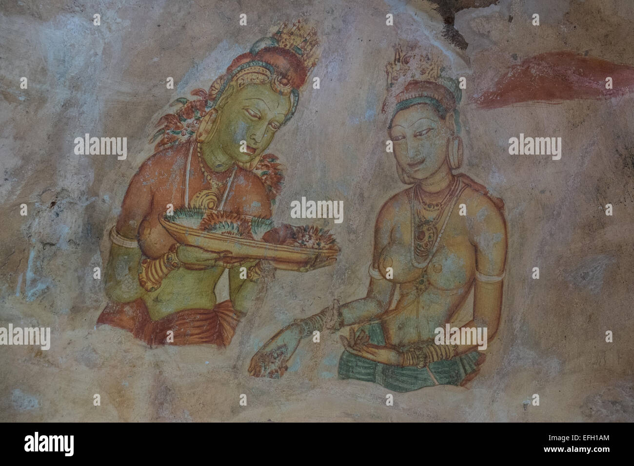 Ancient frescoes of maidens on cave wall at Sigiriya Rock Fortress, Sigiriya, Sri Lanka,Sigiriya,Sri Lanka,rock,unesco,cave,art Stock Photo