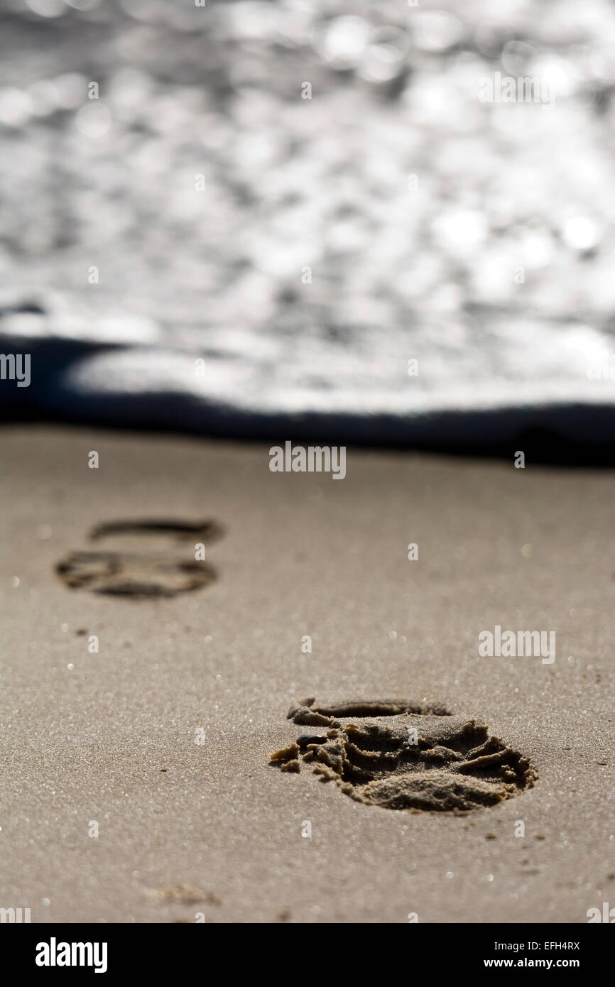 foot prints on each shoe boot Stock Photo