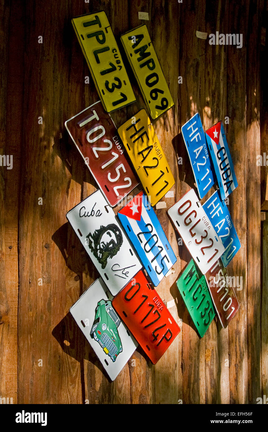 Vertical close up of colourful metallic number plates for sale in Cuba. Stock Photo