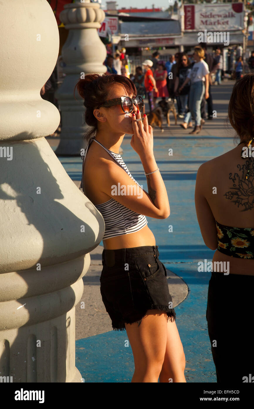 Woman smoking, Venice Beach, Los Angeles, California, USA Stock Photo