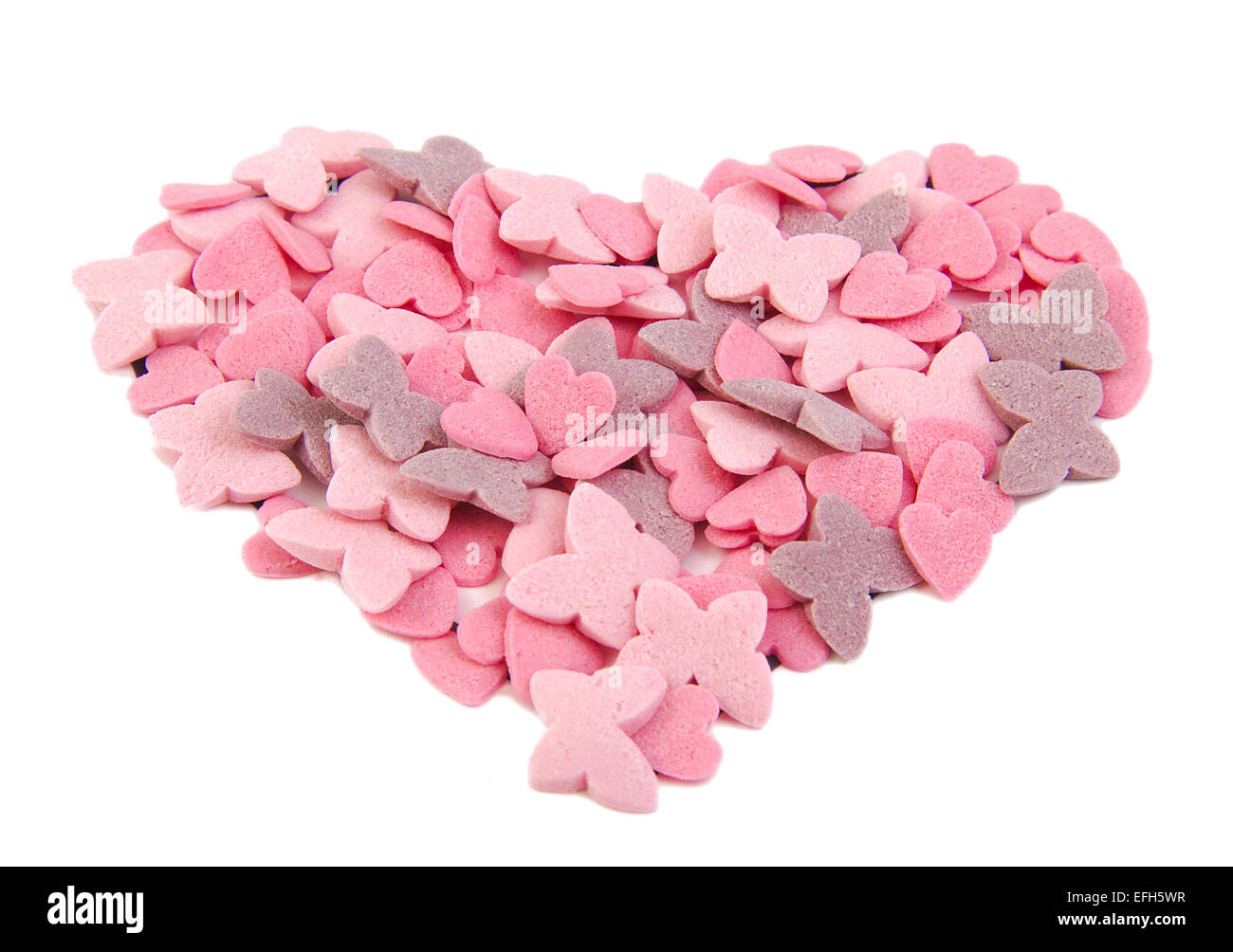 Love heart shape formed with sugar items isolated on white background. Love concept. Valentine's Day concept Stock Photo