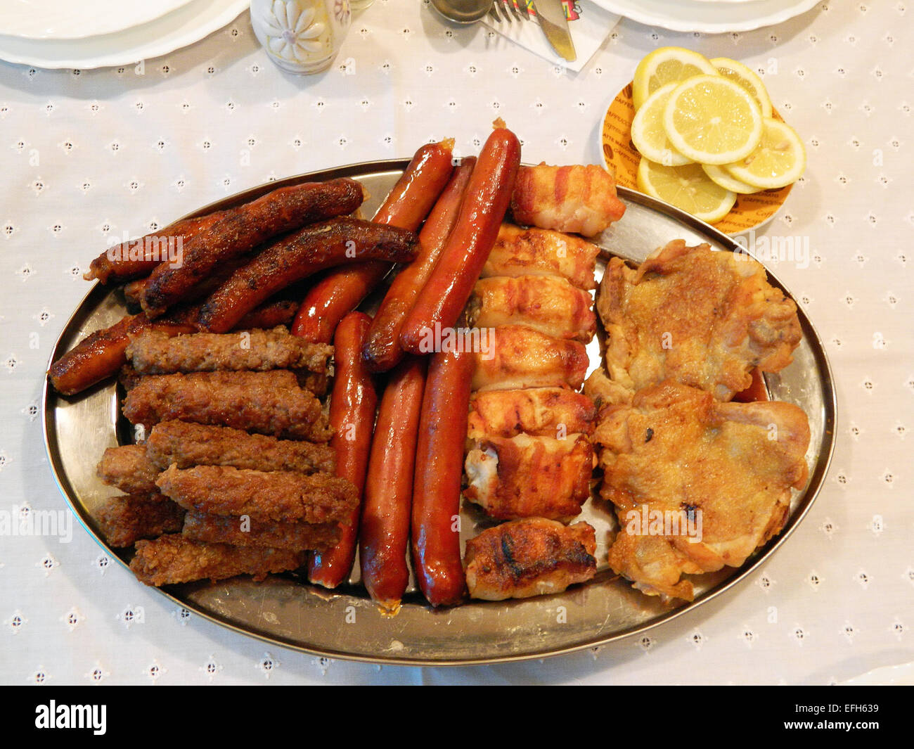 Mixed meat served at the table for the birthday celebration. Stock Photo