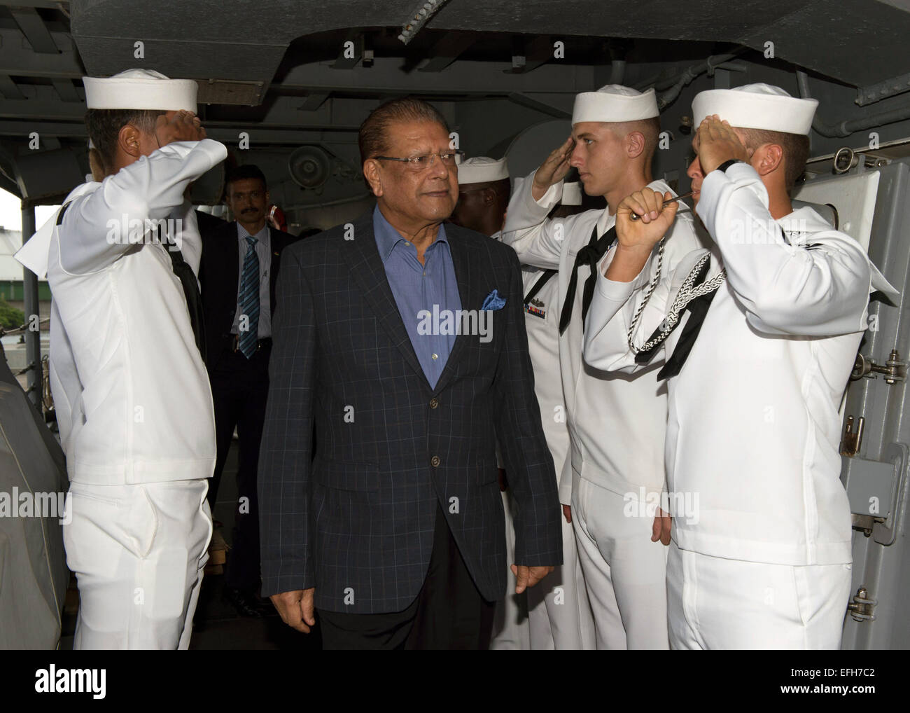Mauritius President Kailash Purryag is piped aboard the Oliver Hazard Perry-class guided-missile frigate USS Simpson by sailors February 3, 2015 in Port Louis, Mauritius. Purryag visited the Simpson while it is in port during Exercise Cutlass Express 2015. Stock Photo