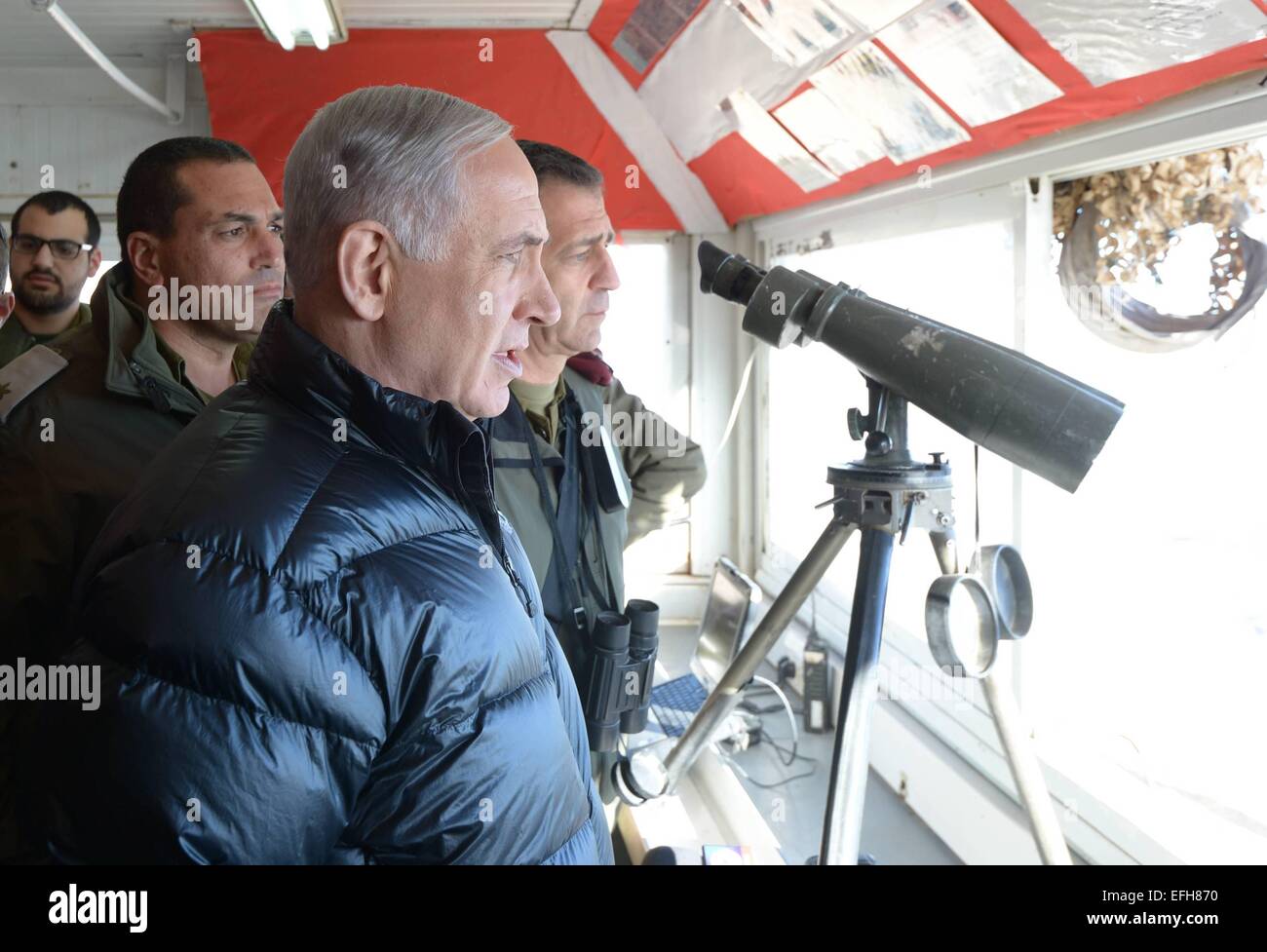 Jerusalem. 4th Feb, 2015. Israeli Prime Minister Benjamin Netanyahu (front) visits an Israel Defense Forces (IDF) base near Mount Hermon, on Feb. 4, 2015. Israeli Prime Minister Benjamin Netanyahu said Wednesday that Iran is trying to open a front against Israel along its border with Syria. Netanyahu visited earlier in the day an Israel Defense Forces (IDF) base near Mount Hermon along with Defense Minister Moshe Ya'alon. Credit:  GPO/Amos Ben Gershom/Xinhua/Alamy Live News Stock Photo
