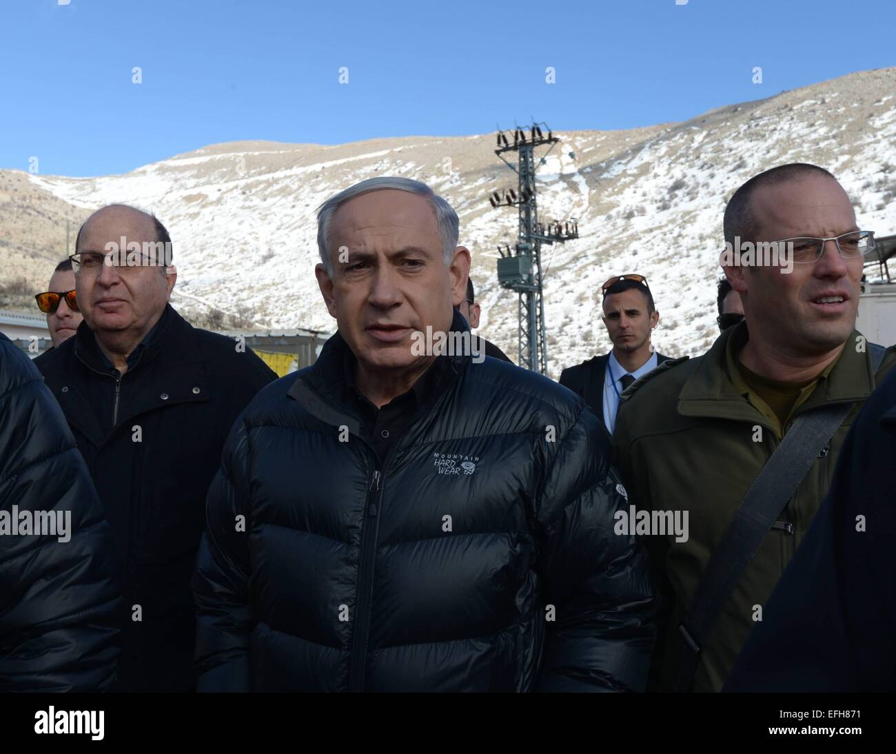 Jerusalem. 4th Feb, 2015. Israeli Prime Minister Benjamin Netanyahu (C) and Defense Minister Moshe Ya'alon (2nd L) visit an Israel Defense Forces (IDF) base near Mount Hermon, on Feb. 4, 2015. Israeli Prime Minister Benjamin Netanyahu said Wednesday that Iran is trying to open a front against Israel along its border with Syria. Netanyahu visited earlier in the day an Israel Defense Forces (IDF) base near Mount Hermon along with Defense Minister Moshe Ya'alon. Credit:  GPO/Amos Ben Gershom/Xinhua/Alamy Live News Stock Photo