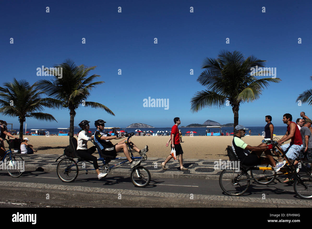 RIO DE JANEIRO, JULY 6:  Fitness enthusiasts works out at fitness workstation on the edge of Copacobana Beach, Rio de Janeiro, Brazil. July 6, 2010.Photo by Lisa Wiltse Stock Photo