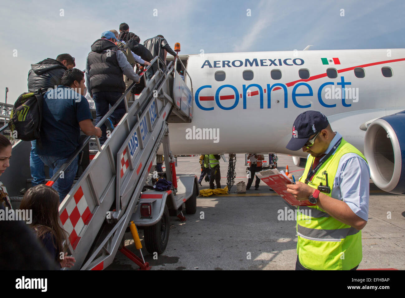 Mexico City, Mexico - Passengers board an AeroMexico Connect plane at the Mexico City airport for a flight to Oaxaca. Stock Photo