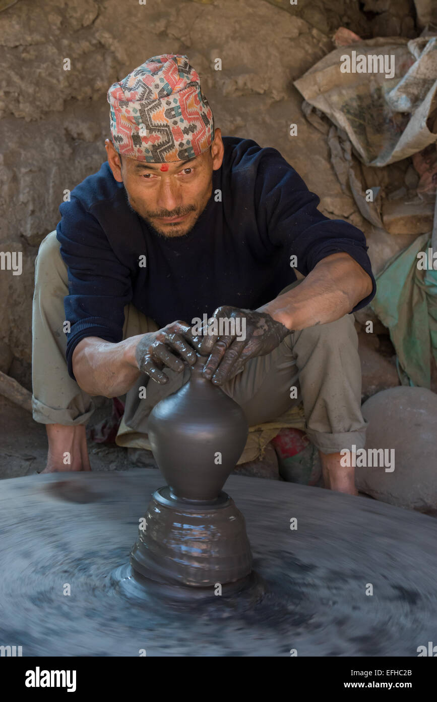 Nepal man throwing a pot by hand at the Potter's Square, Bhaktapur, Kathmandu Valley, Nepal Stock Photo