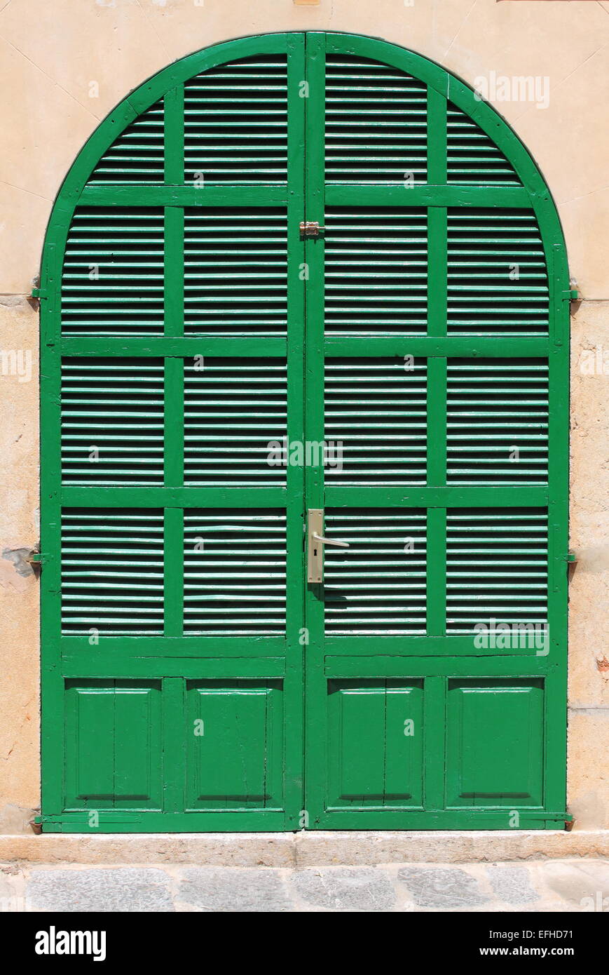 Italian style house entrance with shutters Stock Photo