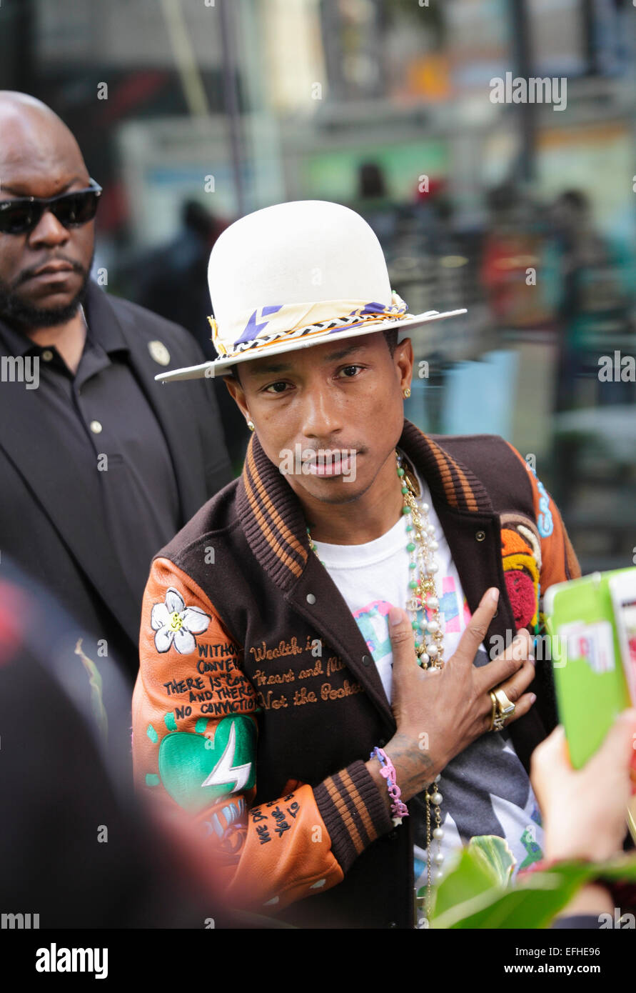 Pharrell Williams accepts well-wishes from fans after receiving a star on the Hollywood Walk of Fame on December 4, 2014, Los Angeles, California, USA Stock Photo