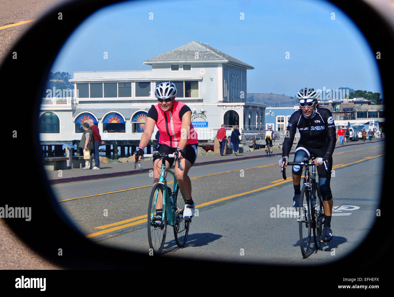 Two cyclists in the street hi-res stock photography and images - Alamy