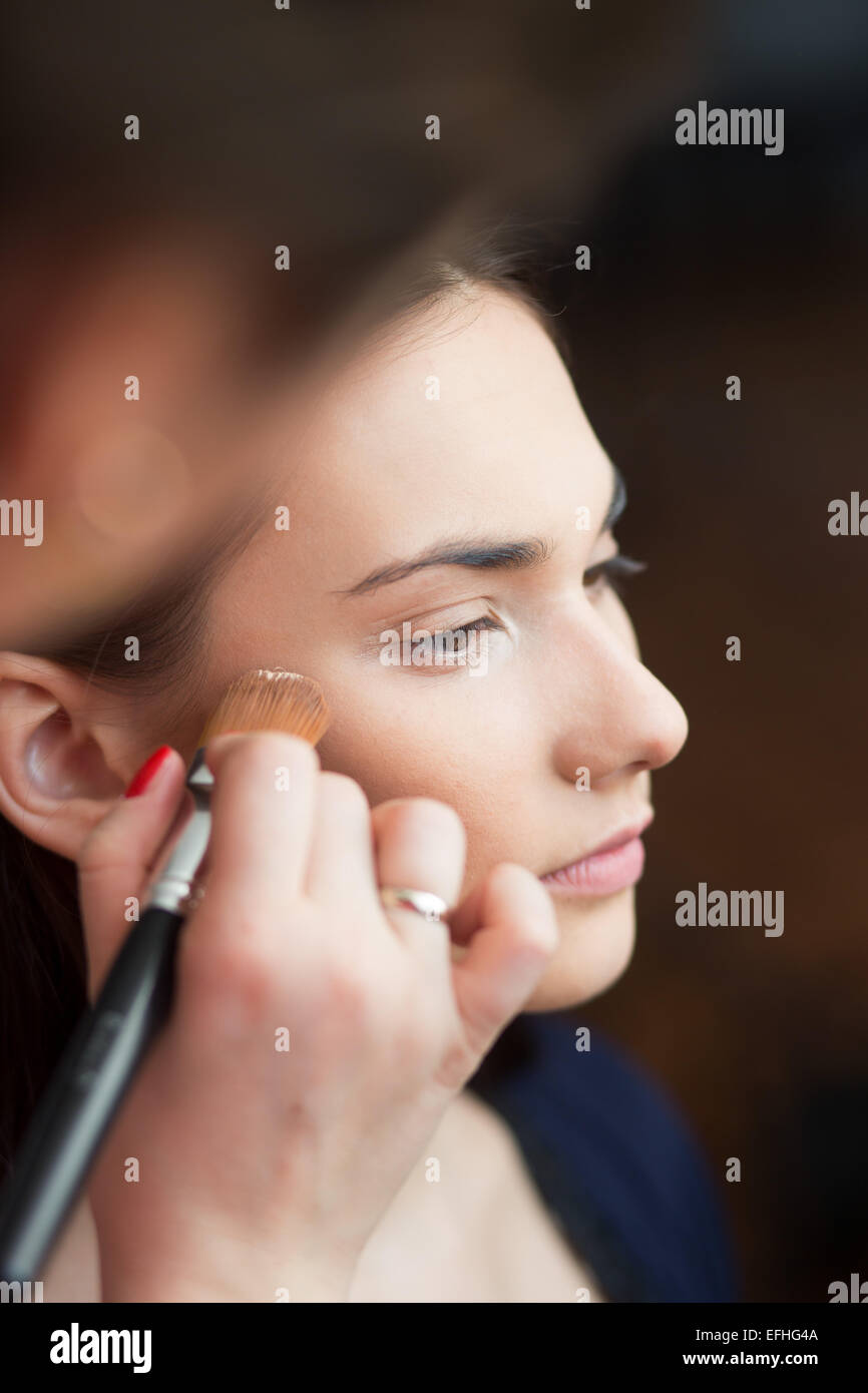 beautiful girl make-up applied. Stock Photo