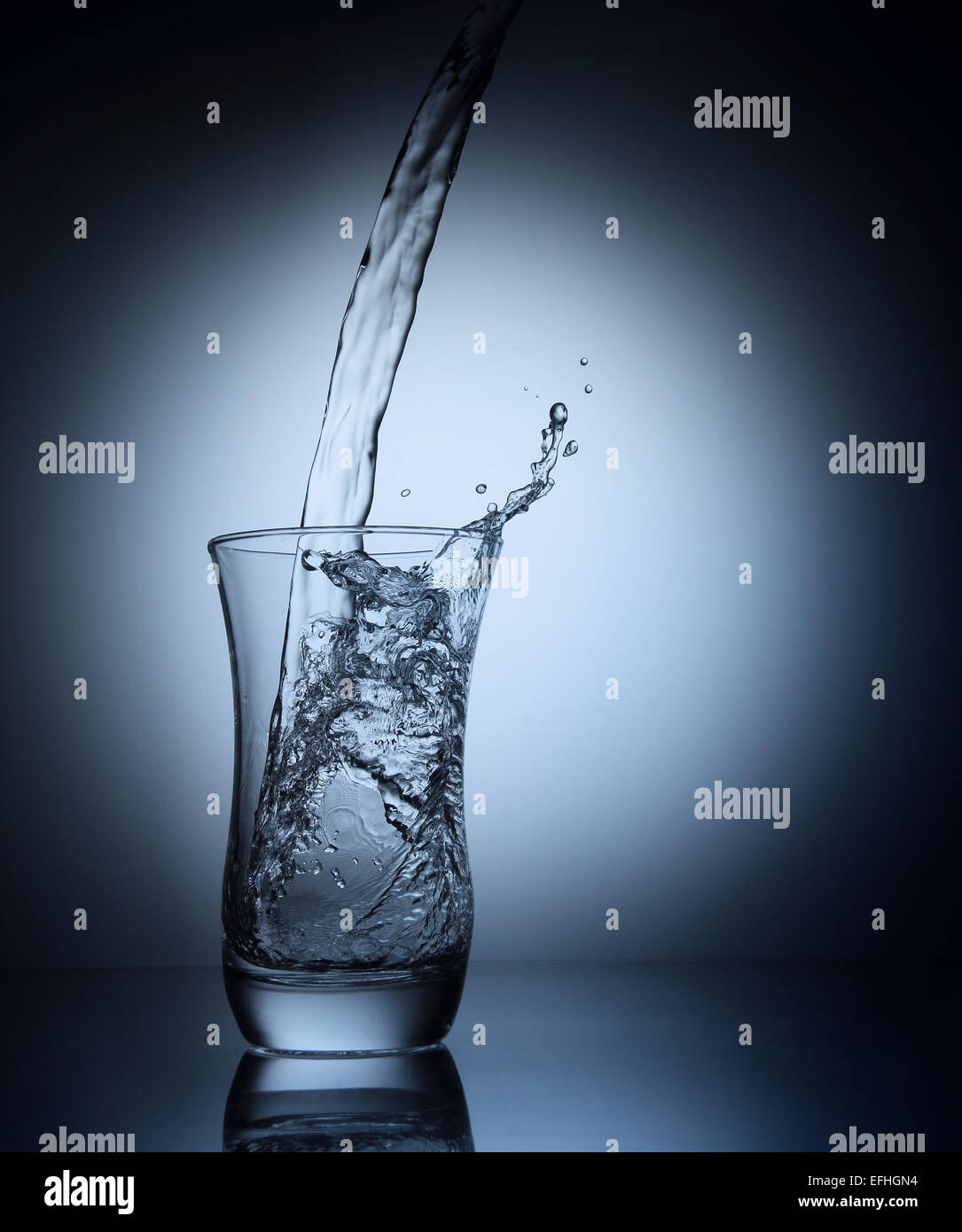 Water pouring into a glass Stock Photo Alamy