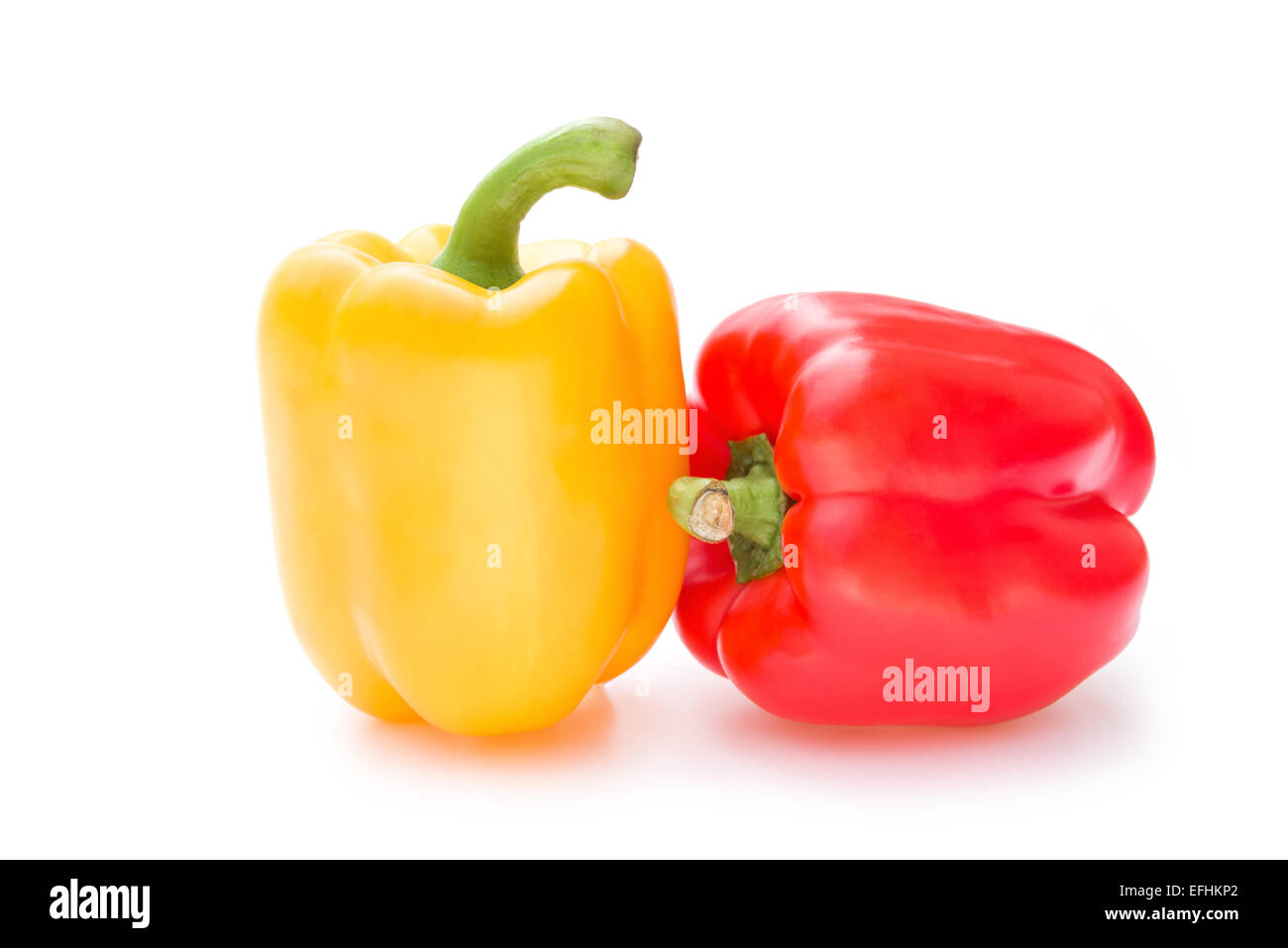 yellow and red bell peppers on a white background Stock Photo - Alamy